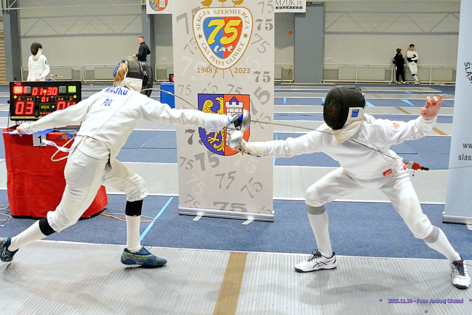 szpadziści na macie